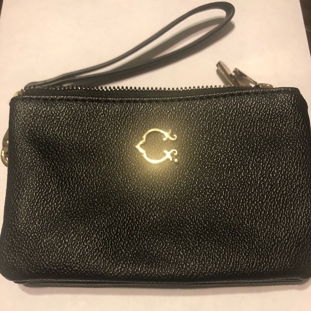Black wristlet with gold accents